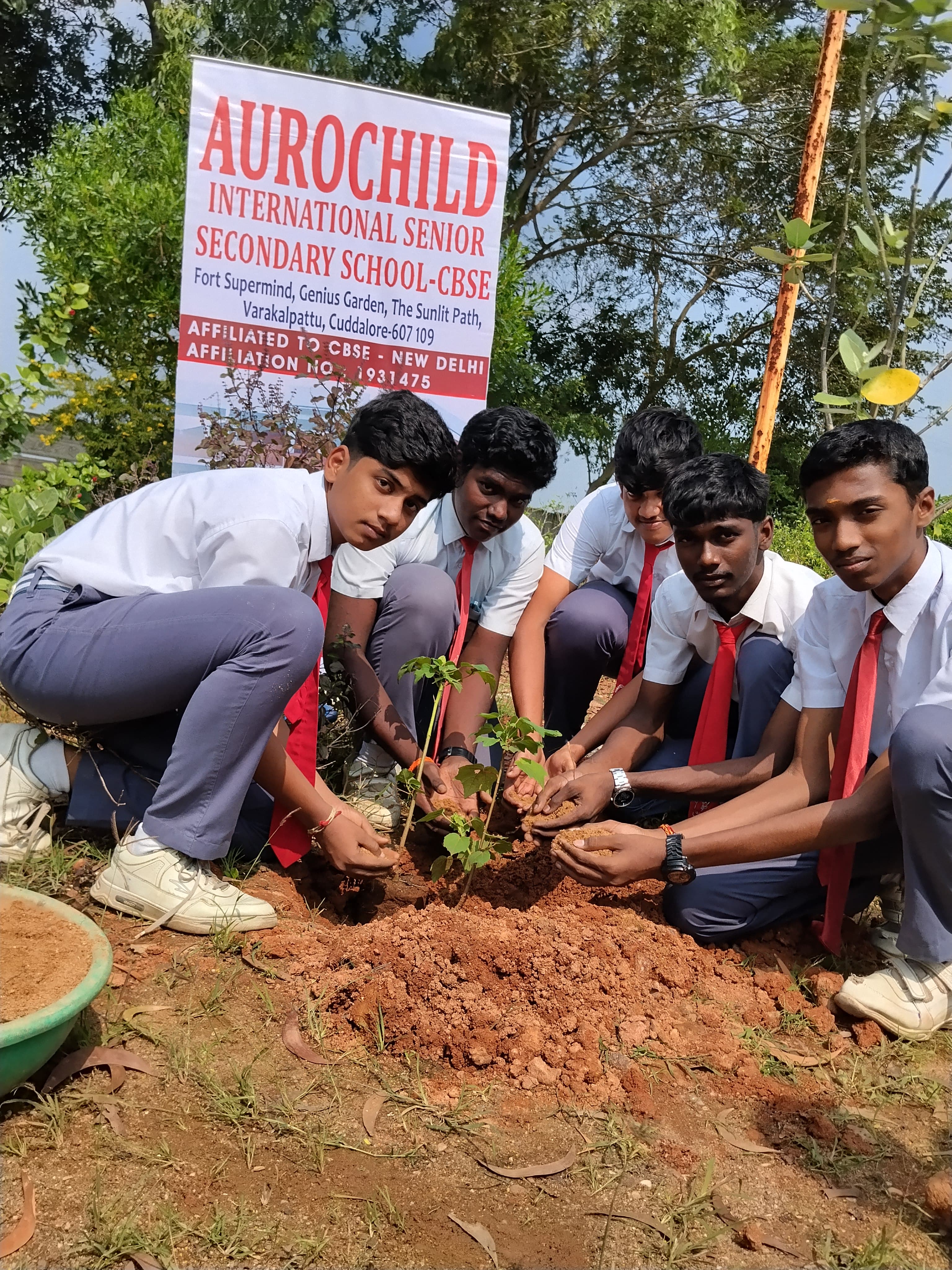 Students planting trees in environmental club initiative