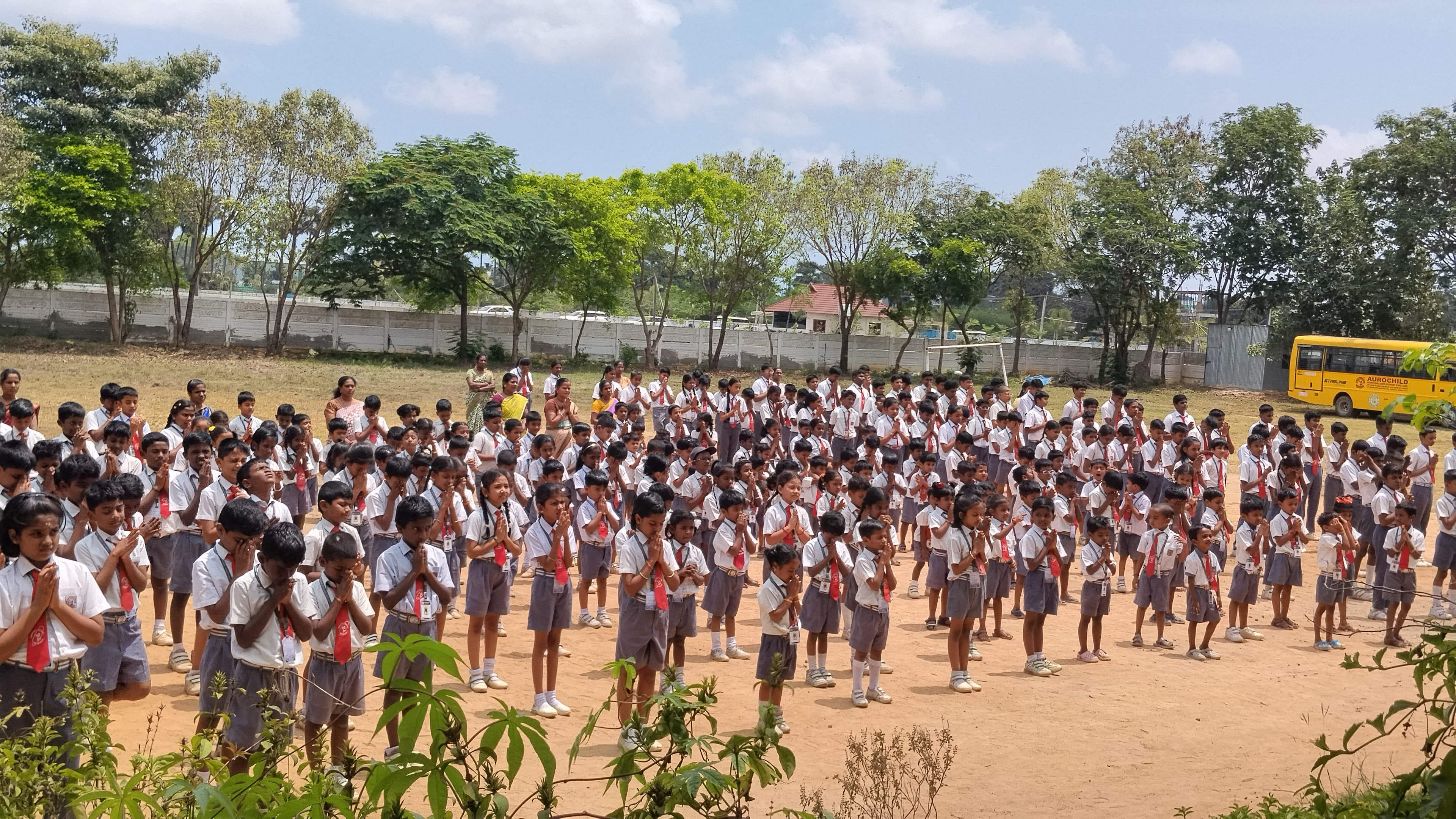 Student speaking at a school assembly at Aurochild