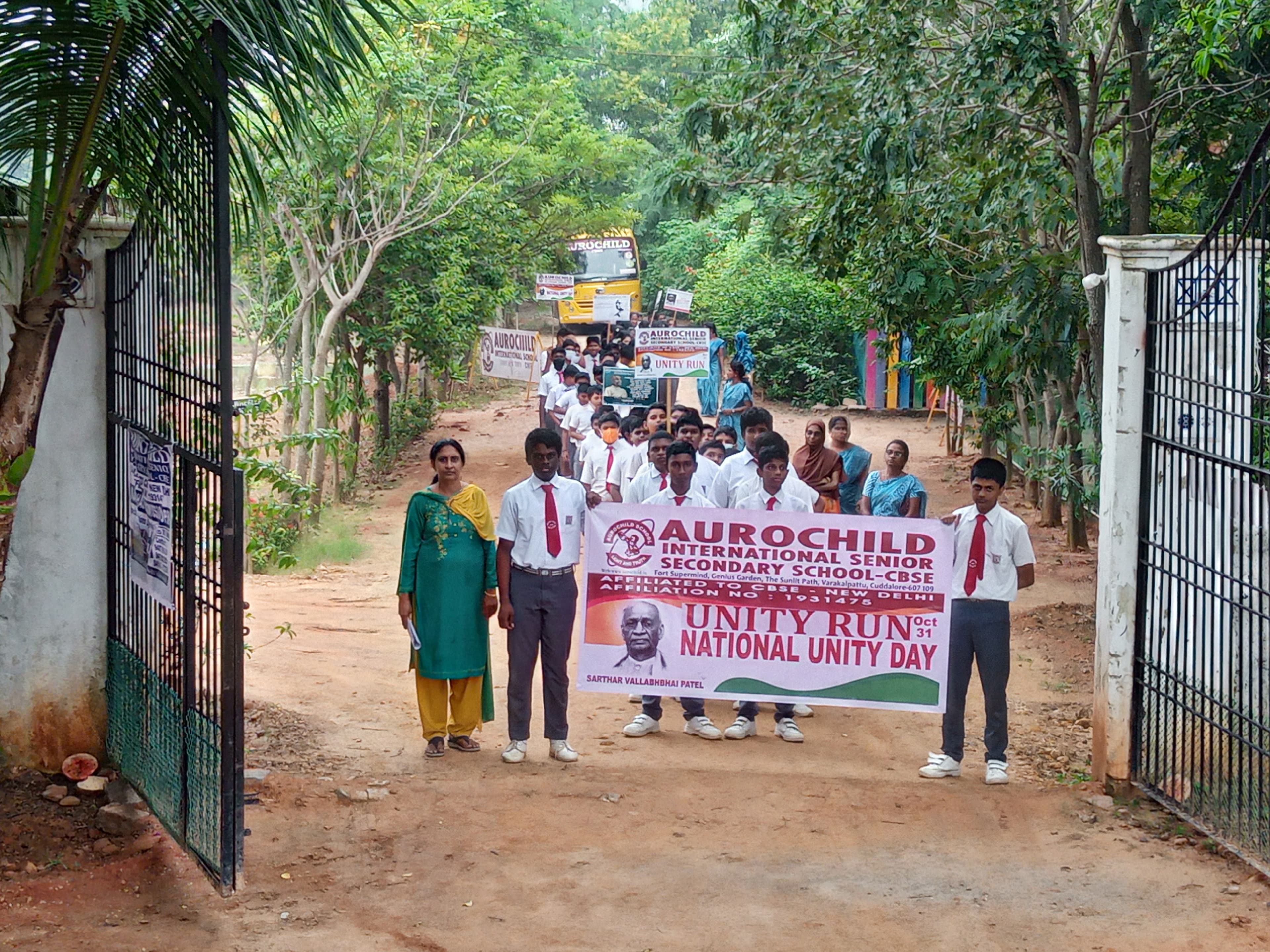 Students participating in a Unity Run environmental rally