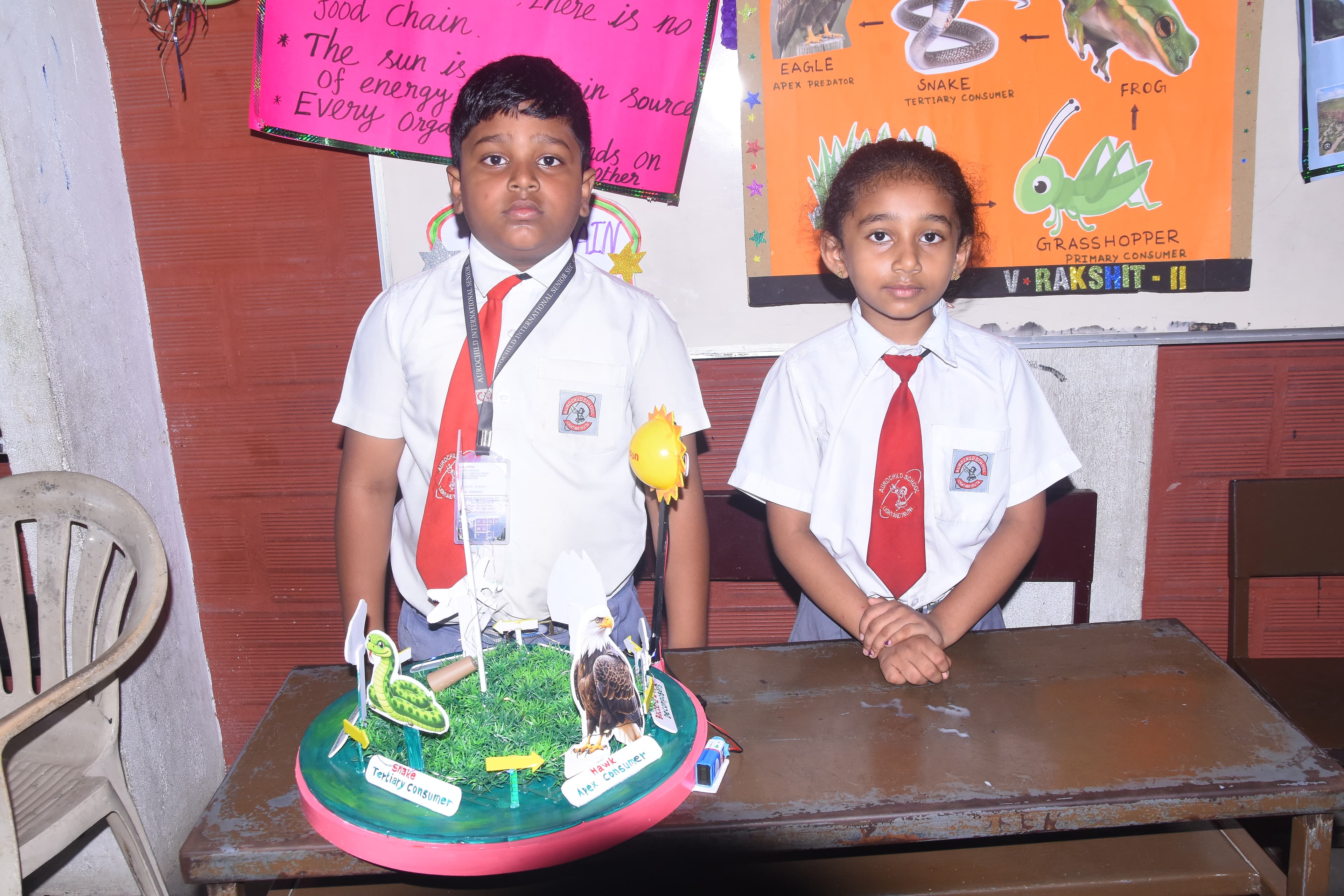 Students presenting their science project at AuroSpark Exhibition