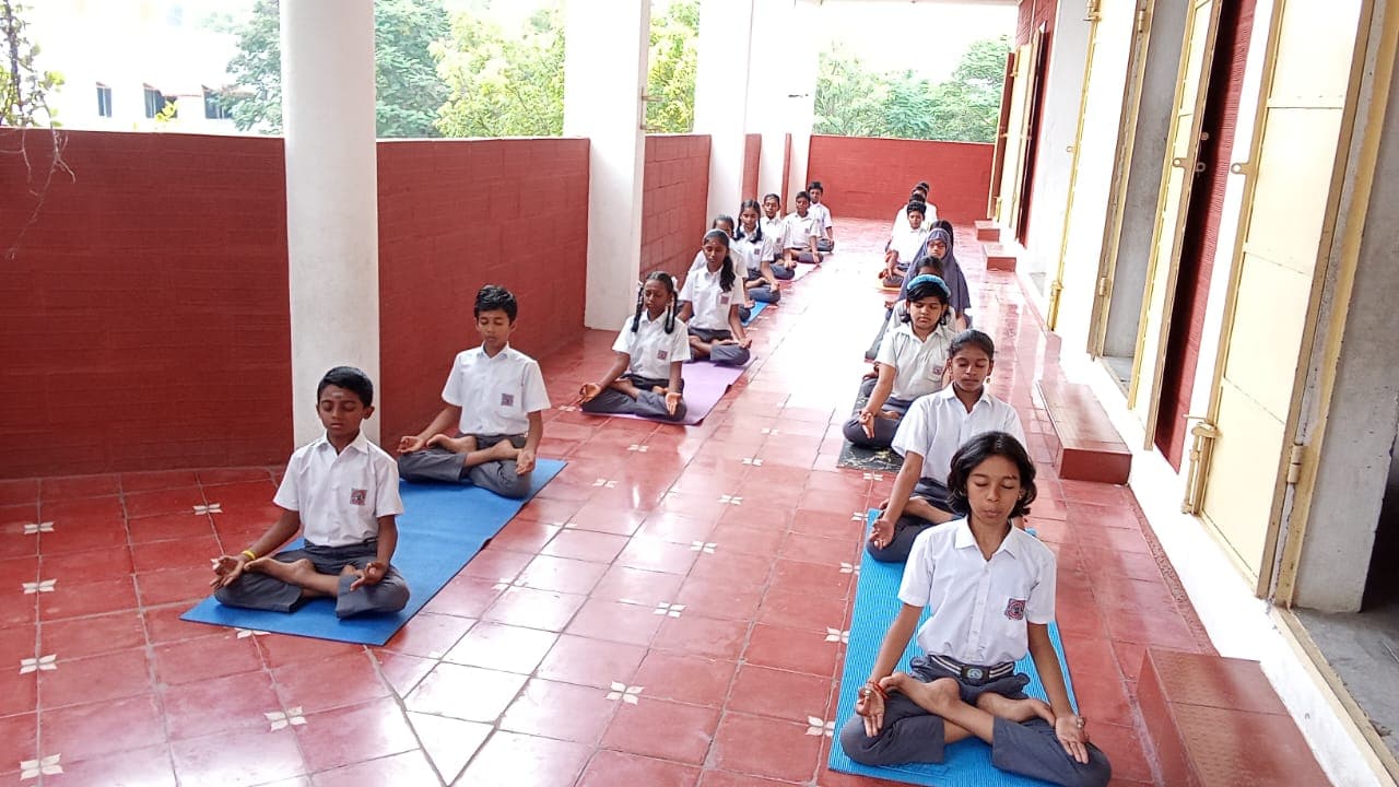 Students practising yoga and mindfulness at Aurochild