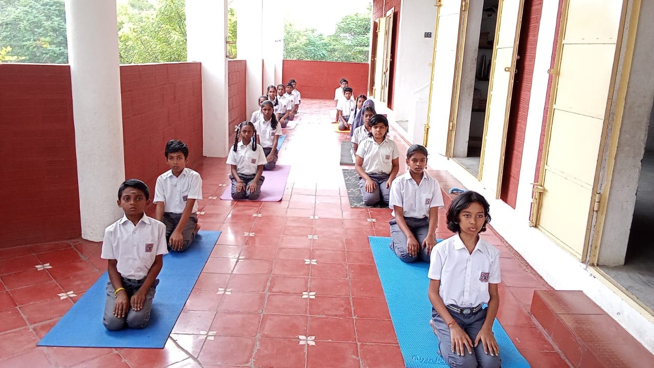 Students participating in a yoga class as part of daily activities