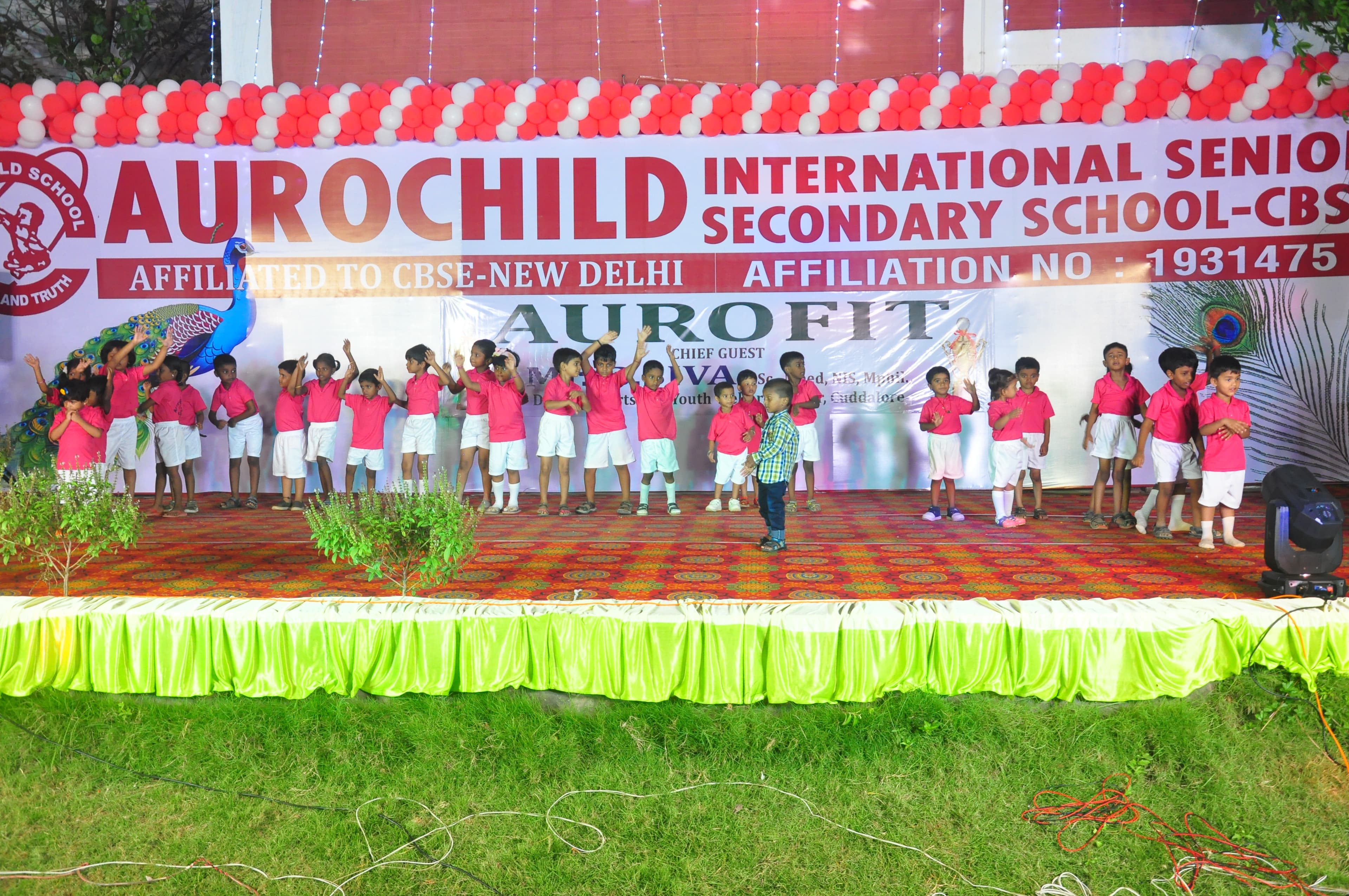 Aurochild students performing together during the sports day opening ceremony