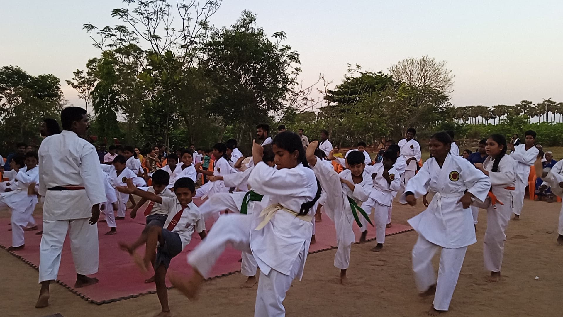 Students practising karate in a training session